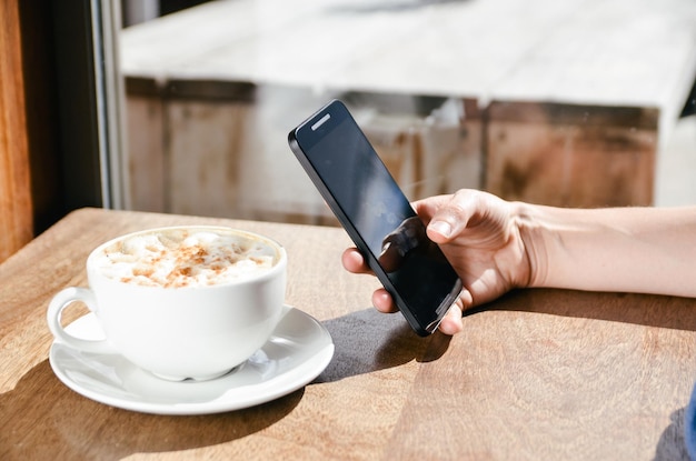 close-up of woman hand holding coffee