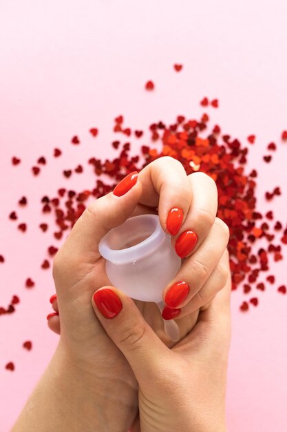 Close up of woman hand holding menstrual cup women's health and
alternative hygiene zero waste alternatives