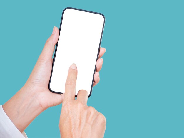 Close up of woman hand touching a smartphone white display on blue background