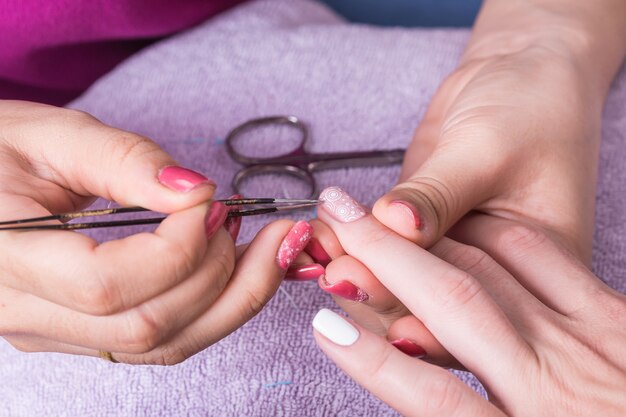 Close up woman hand while process of manicure