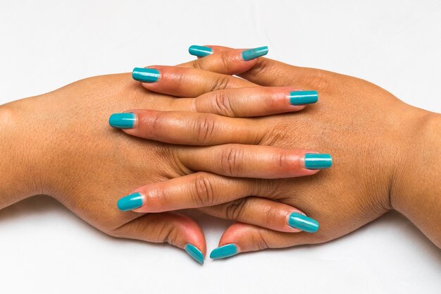 Close-up of woman hand over white background