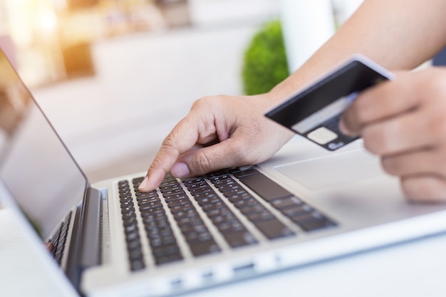 Close up woman hands holding credit card