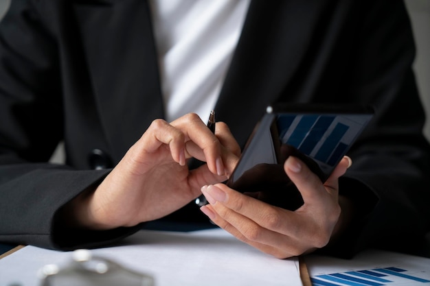 Close up of woman hands using smartphone