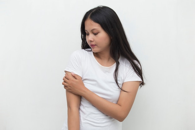 Close up woman having pain in injured elbow