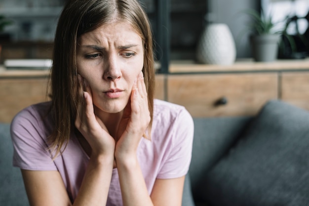 Close-up of a woman having tooth ache