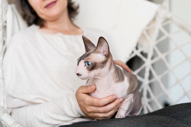 Close up woman holding cat