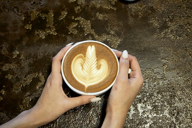 Close-Up Of Woman Holding Coffee