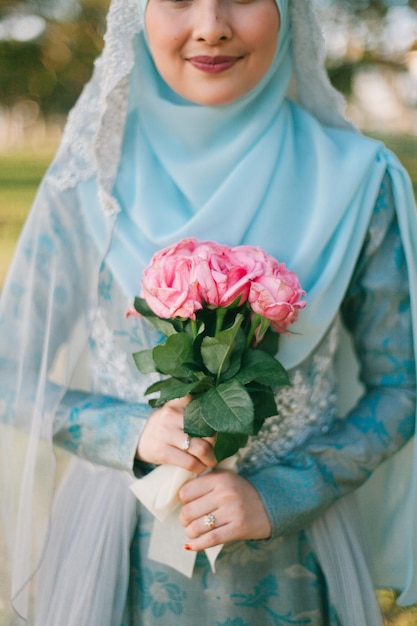 close-up of woman holding flower