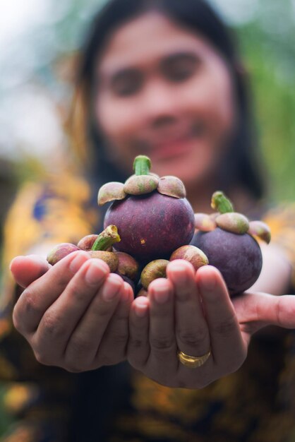 Photo close-up of woman holding fruits