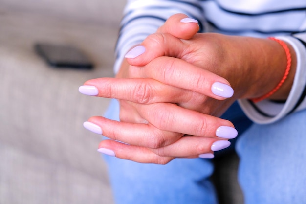 Close-up of woman holding hands