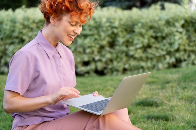 Close up woman holding laptop