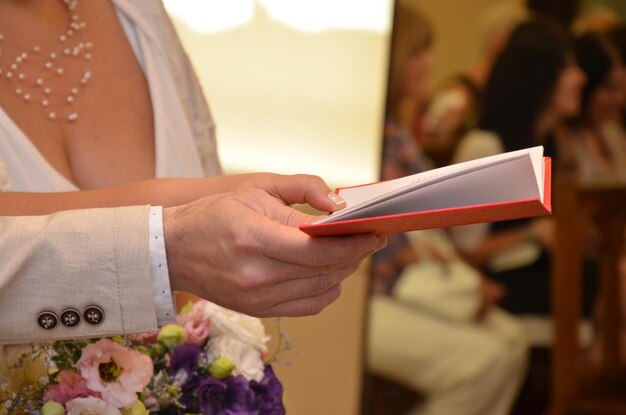 Close-up of woman holding mobile phone