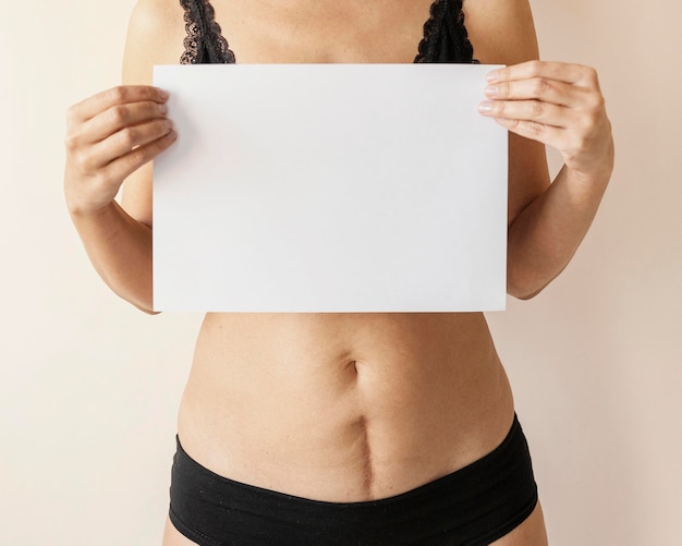 Close up  woman holding paper piece