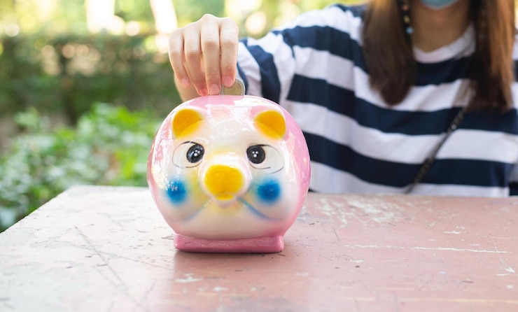 Photo close-up of woman holding toy on table