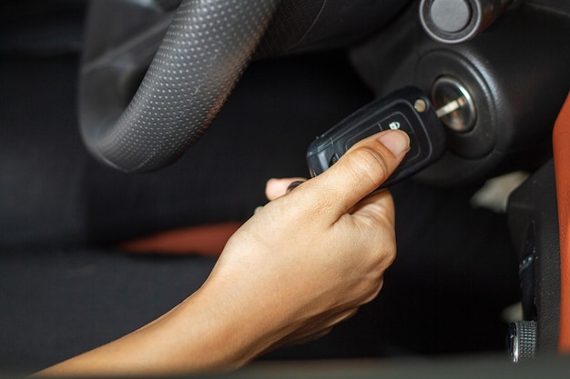 close-up of woman inserting car key