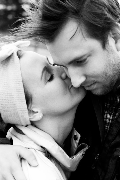 close-up of woman kissing man