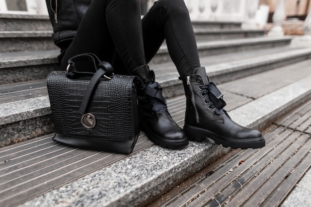 close up of a woman leather shoes and bag