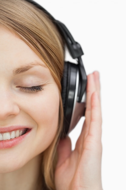 Close up of a woman listening music