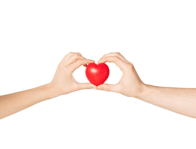 close up of woman and man hands with heart