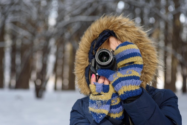 close-up of woman photographing through camera
