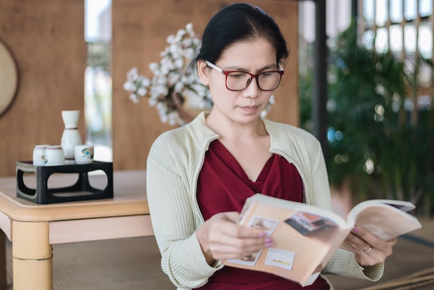 close-up of woman reading documents at home
