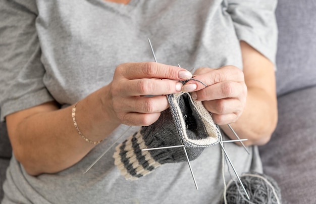 Close up on woman's hands knitting close up of the knitting needles