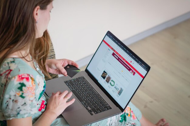 A close up woman shopping online with credit card