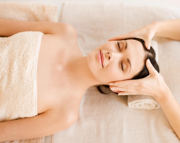 close up of woman in spa salon getting face treatment