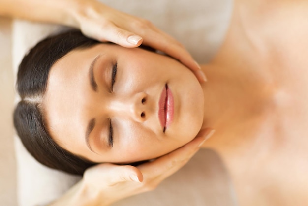close up of woman in spa salon getting face treatment