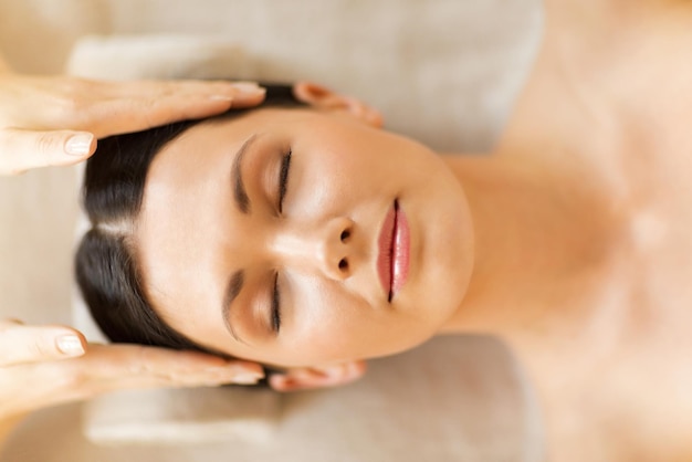 close up of woman in spa salon getting face treatment