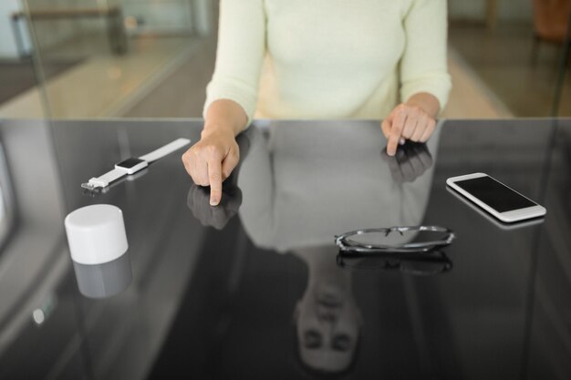 close up of woman using black interactive panel