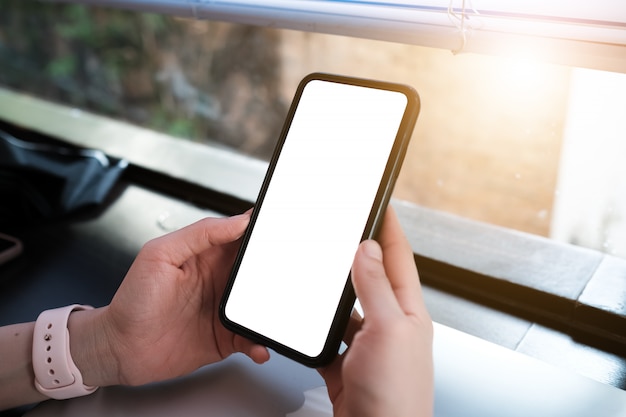 Close up of woman using cell phone on the cafe