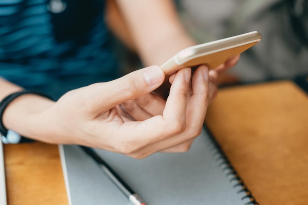 Close-up of woman using mobile phone