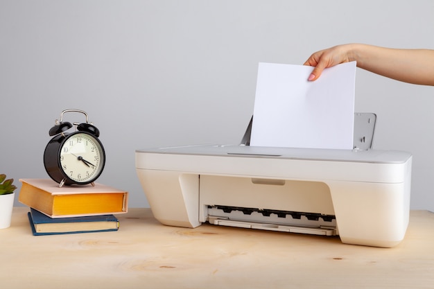 Close up of woman using a printer machine