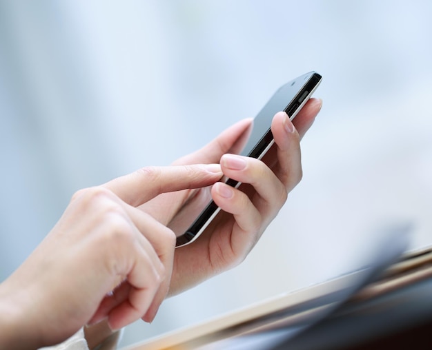 Close up of a woman using smartphone