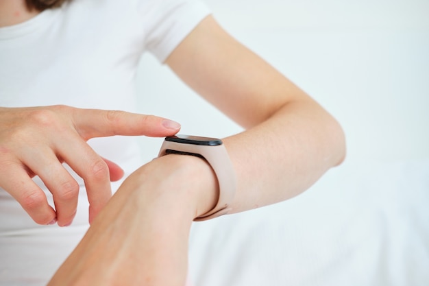 Close up on woman using smartwatch