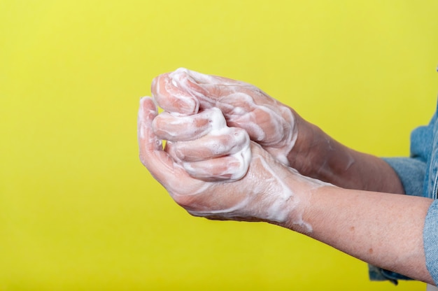 Close-up Woman Very Carefully Washing Hands with Soap During Pandemic. 