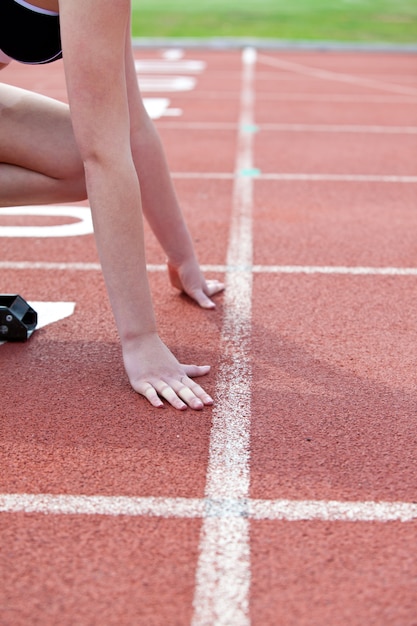 Close-up of a woman waiting in starting block