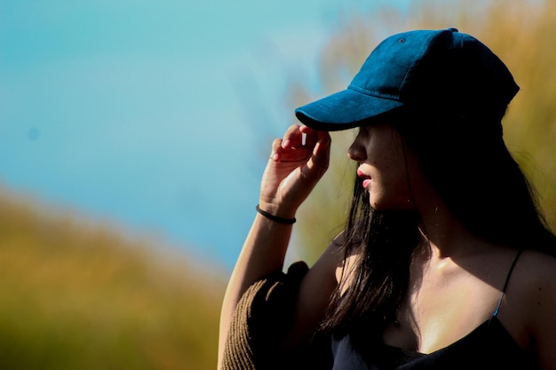 Close-up of woman wearing cap