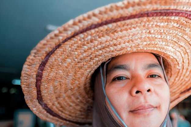 Close-up of woman wearing hat