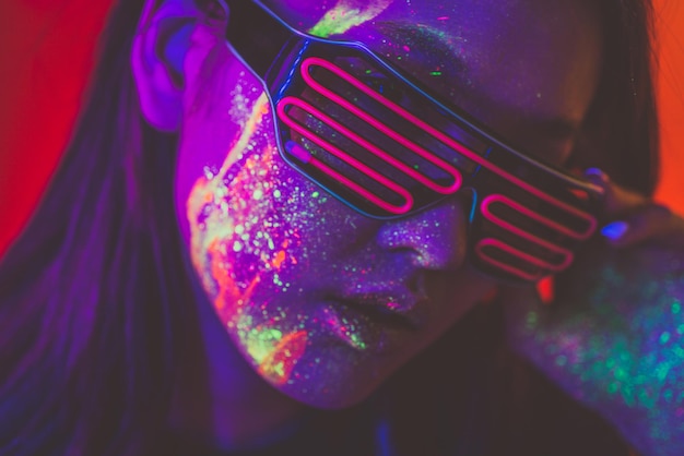 Photo close-up of woman wearing multi colored light painting