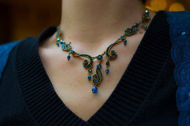 Close-up of woman wearing necklace