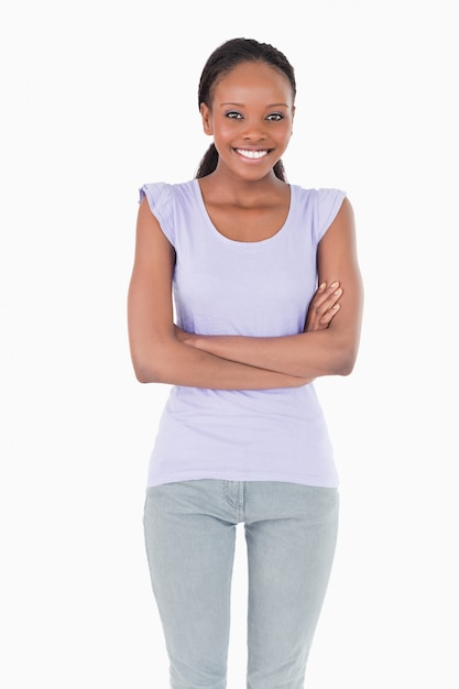 Close up of woman with arms folded on white background