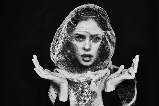 Photo close-up of woman with face paint against black background