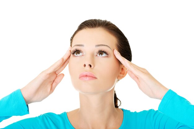 Photo close-up of woman with headache against white background