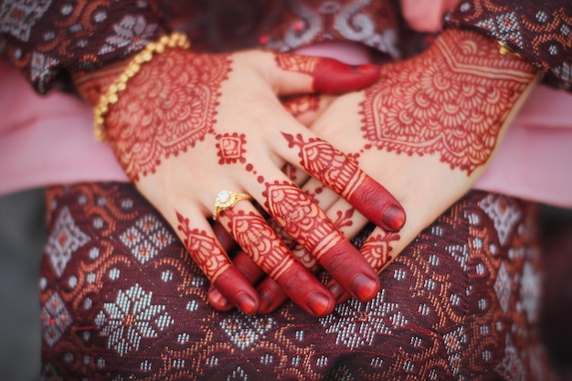 close-up of woman with henna tattoo