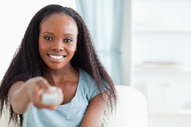 Close up of woman with remote control