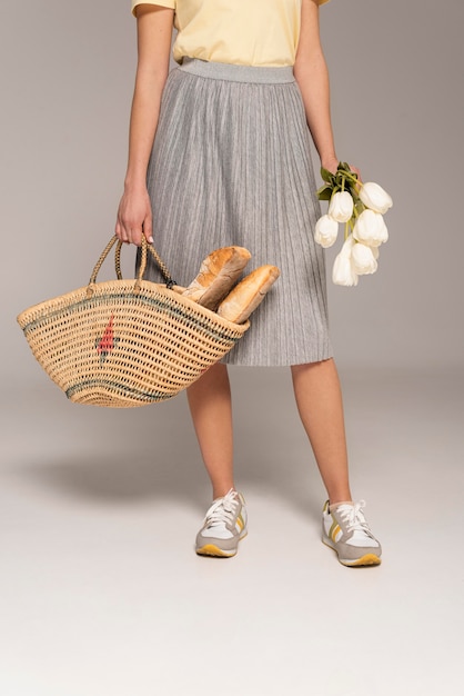 Close up woman with reusable bag with bread