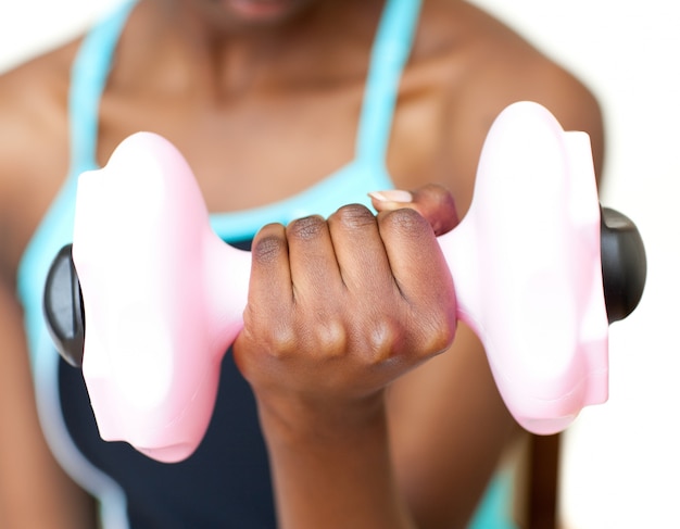 Close-up of a woman working out with dumbbell 