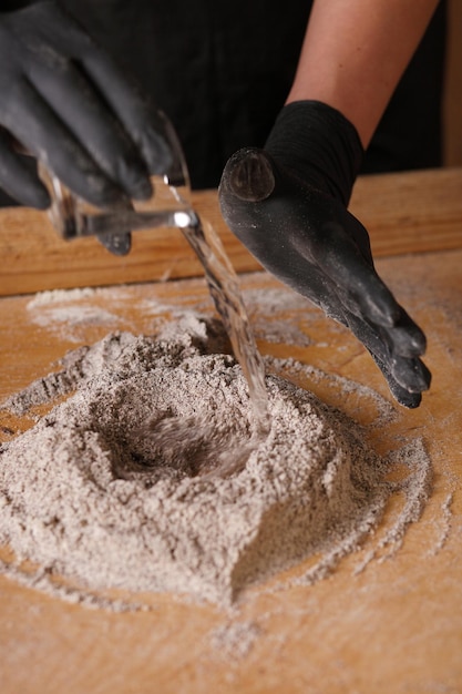 Close up of womans hands making a bread